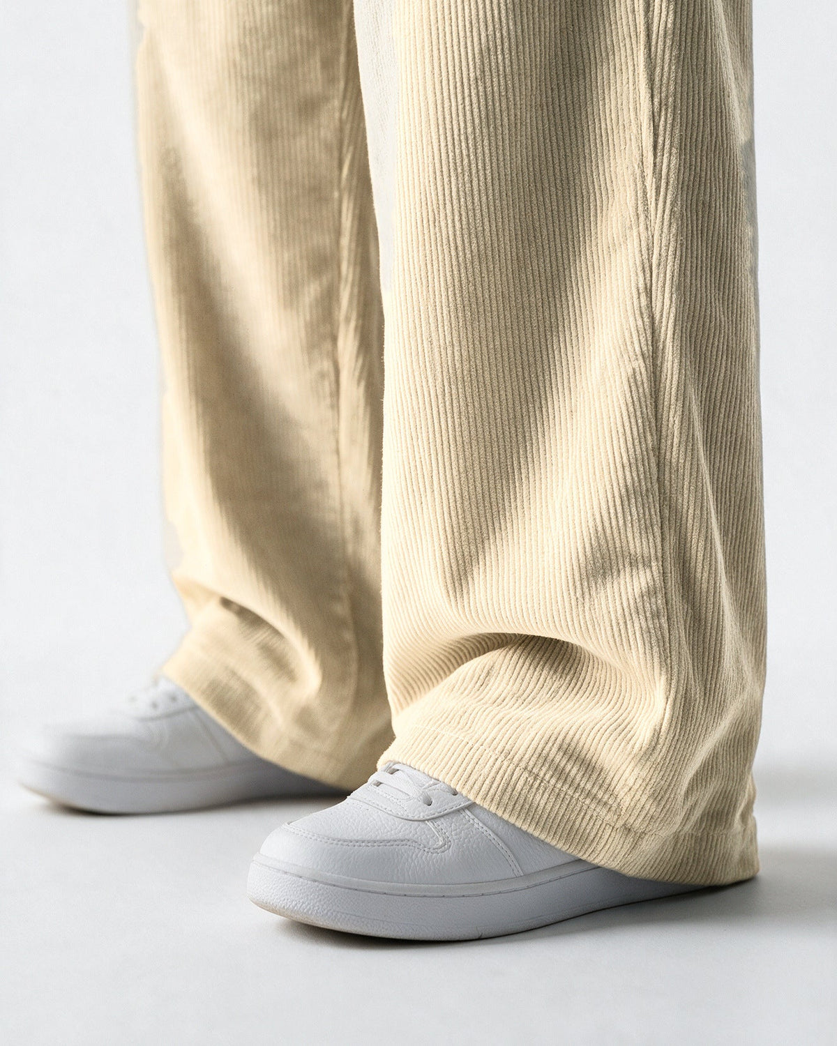 Tilbury wide hem over a trainer, close-up