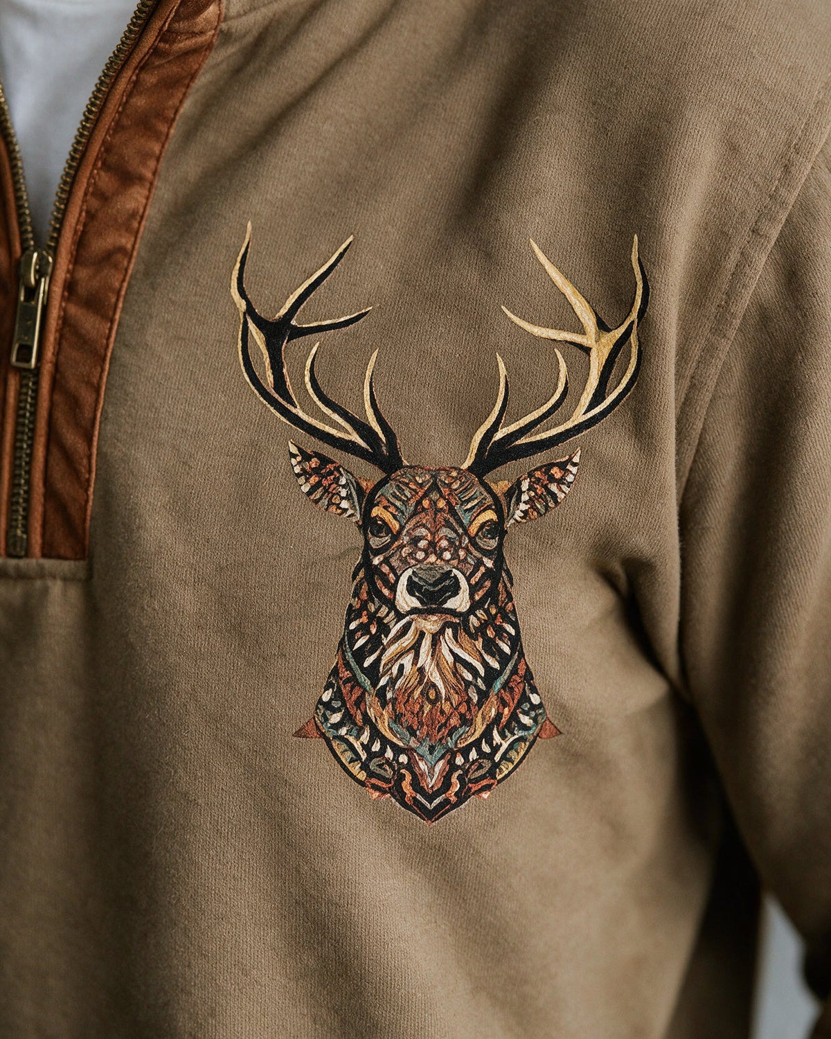 Glenmore deer-head print on the chest, close-up