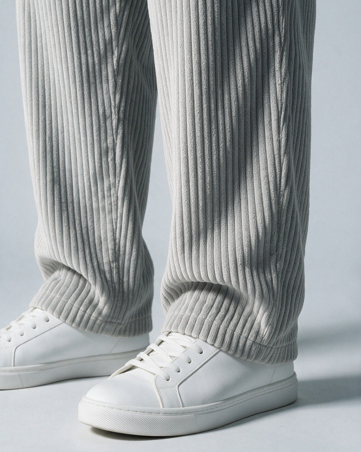 Wexford wide-wale corduroy hem over a trainer, close-up